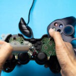 Technician repairing the internal components of a game controller