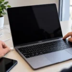 Person troubleshooting a MacBook that will not turn on while connecting the charger
